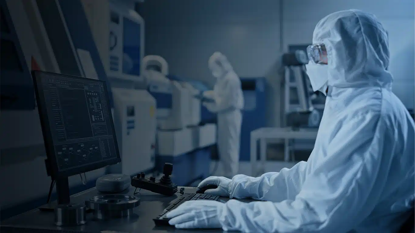 Lab worker using a computer to access Honeywell Batch Historian software